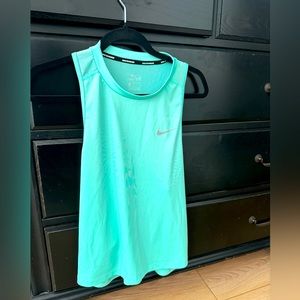 Ladies running dry fit top.  More like a teal color.